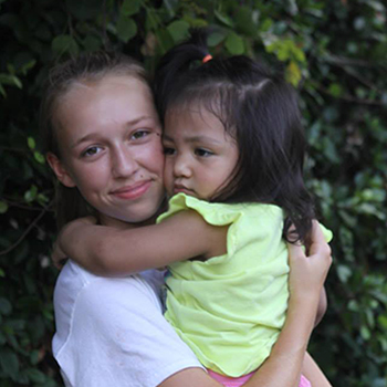 A woman holding a child